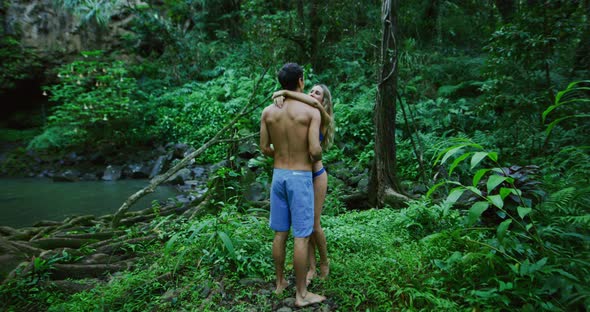 Couple Exploring Jungle Waterfall