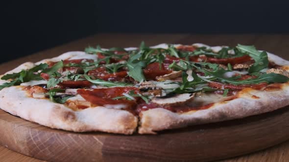 Appetizing Pizza on a Wooden Board in a Restaurant