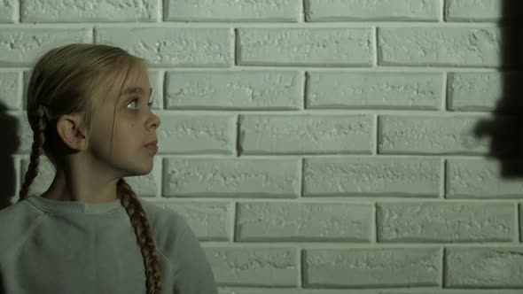 Girl Looking at Shadow of House on Wall, Orphan or Refugee Dreaming About Home