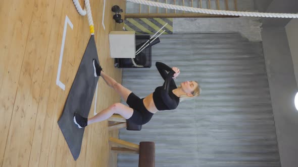 Vertical Video Sporty Blonde Woman Doing Sports Doing Exercise Squats in Different Directions