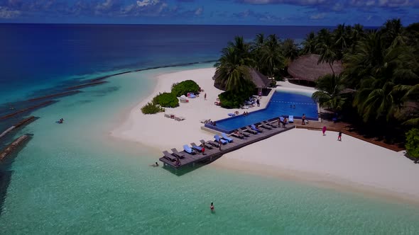 Luxury drone copy space shot of a sunshine white sandy paradise beach and blue sea background in vib