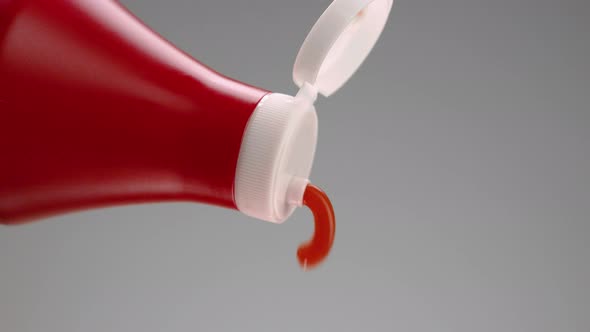 Ketchup being squeezed out of bottle