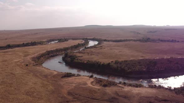 Aerial shot of Mara river and savannah