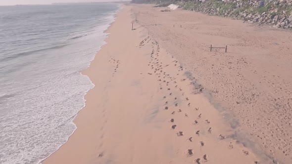 White sandy Mundakkal beach near Kollam, Kerala, India. Aerial drone view