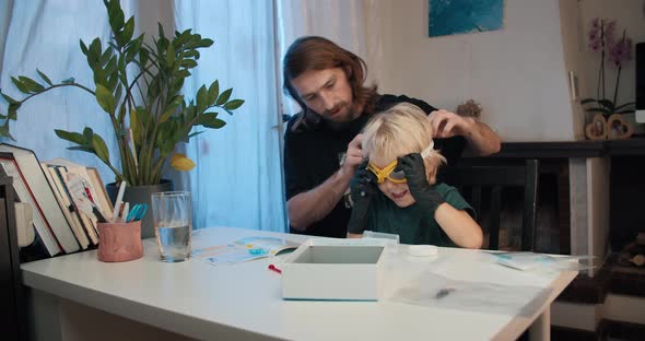 Cheerful Family Preparing to Learn Make Chemical Experiment at Home