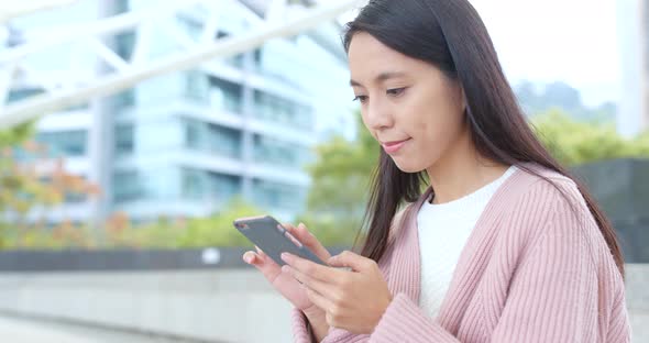 Woman using mobile phone at outdoor