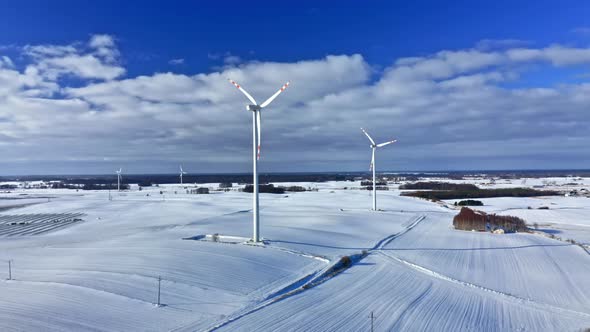 Wind turbine in snowy winter. Alternative energy in winter.