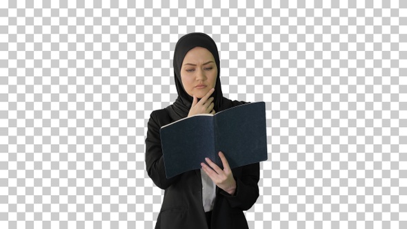 Muslim Businesswoman reading her business, Alpha Channel