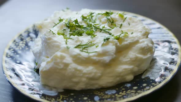 Cottage Cheese with Herbs on a Plate