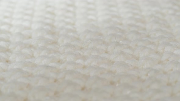 White Knitted Cloth Light Woolen Clothes Fabric Closeup Woven Textile Background