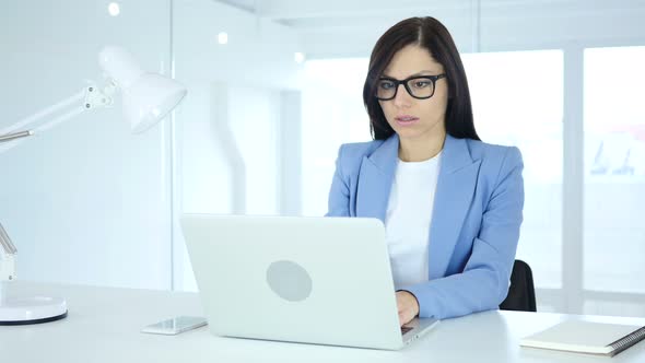 Shocked, Young Businesswoman Wondering at Work