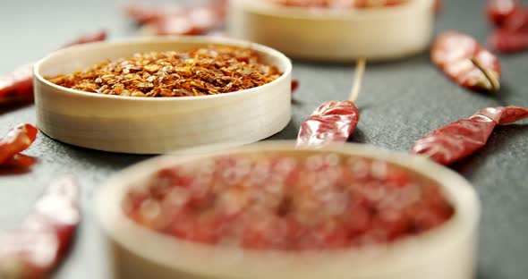 Dried red chili pepper and crushed red pepper in bowl 4k