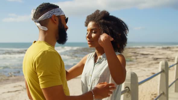 Couple interacting with each other at beach 4k