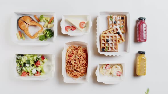 Food Delivery Top View Take Away Meals in Disposable Containers on White Background
