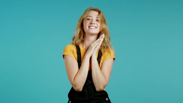 Applauding Girl with Blonde Hair Is Very Glad and Happy, She Claps Hands Because of Excellent News