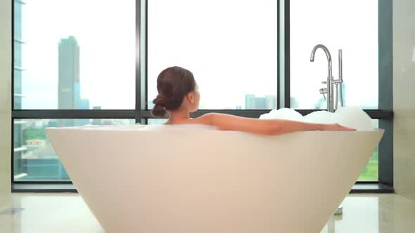 Young asian woman relax in bathtub