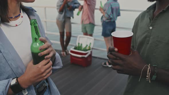 Unrecognizable Couple on Party by Lake