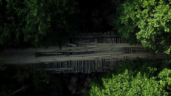 Top Down View of Wood Bridge Over the River in Caucasus Rainforest