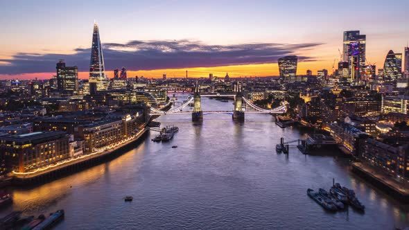 Forwards Reveal of City Lights of Large Town at Dawn