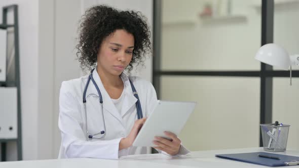 Female African Doctor Using Tablet