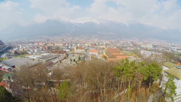 Aerial Shot, Beautiful City at Bottom of Mountains, Austrian Innsbruck in Spring