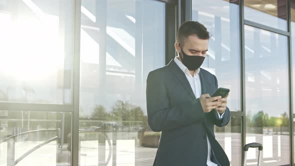 Elegant businessman in airport. Young mail entrepreneur in formalwear.