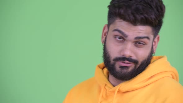 Face of Funny Young Overweight Bearded Indian Man Acting Childish