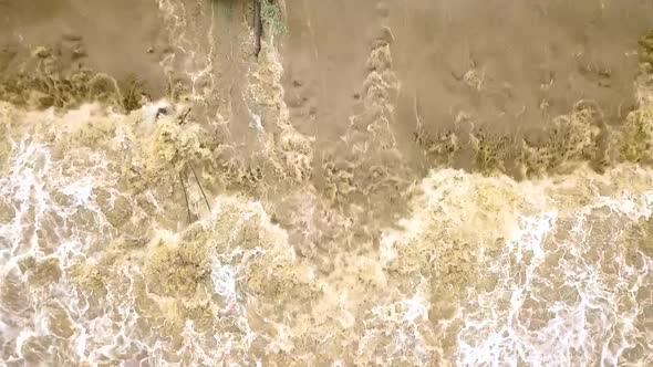 Aerial view of dirty river with muddy water in flooding period during heavy rains in spring.