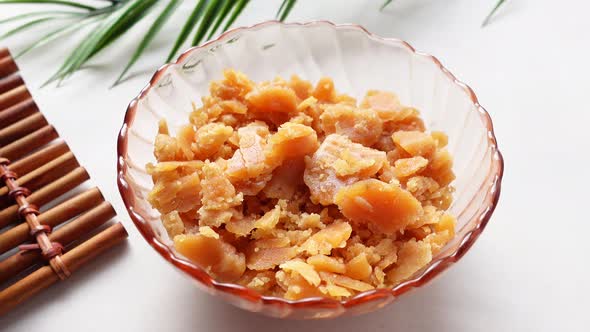 Stack of Jaggery Traditional Cane Sugar Cube on Table