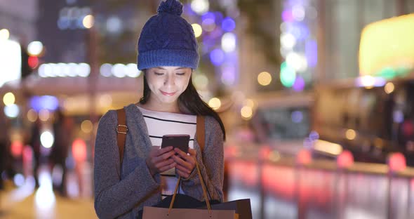 Woman use of cellphone at night