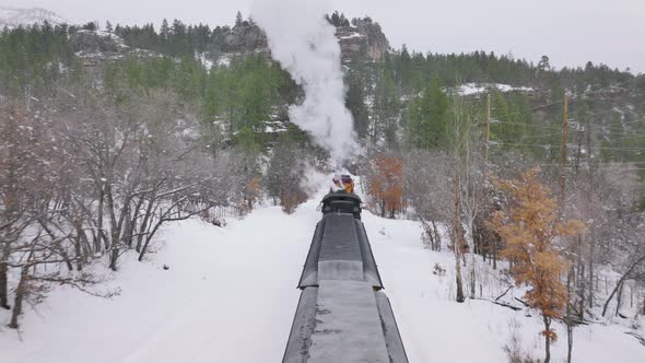 Aerial Cinematic Above Moving Steam Train Railroad Tour By Old Historic Train