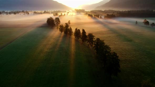 Drone Over Misty Sunlit Landscape Of Zell Am See