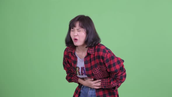 Stressed Asian Hipster Woman Having Stomachache