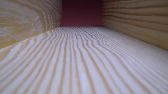 Wood Surface Texture Stock Footage. A Dolly Close Up Shot of a Piece of Wood Showing Detailed Grain