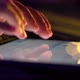 Close up shot of female hand using tablet touching and typing on screen. - VideoHive Item for Sale