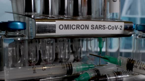 Putting test tubes into rack labelled as Omicron, after specimen collection. Close Up