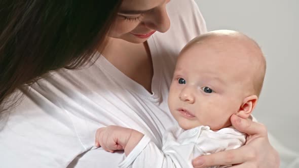 Mother Holding Adorable Baby