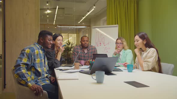 Business Team Watching Webinar Online on Laptop