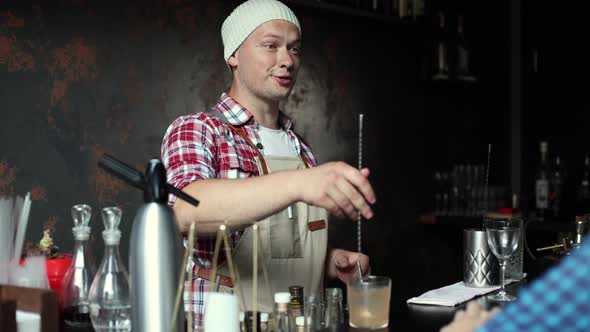 Barman at Work Preparing Cocktails