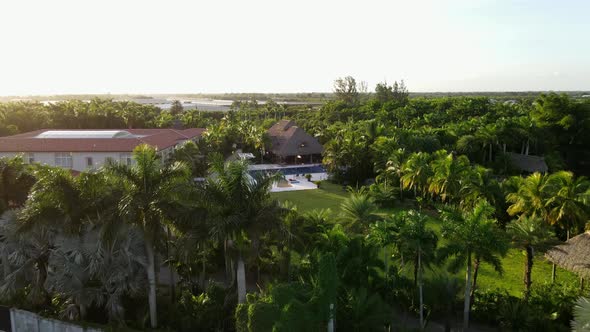 Aerial view of a nice property in southern florida, pool and a tiki tropical vibes travel resort
