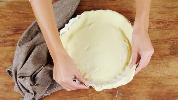 Woman preparing fruit tart