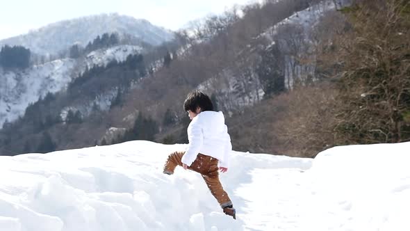 Cute Asian Child Playing Snow Outdoors Slow Motion