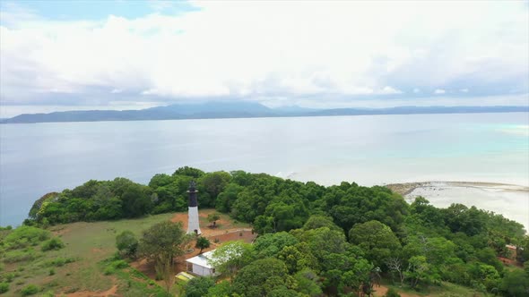 orbit shot of a lighthouse on a tropical island in the Indian Ocean off Madagascar