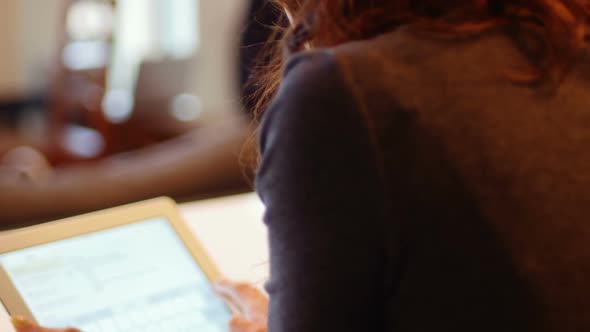 Woman using digital tablet