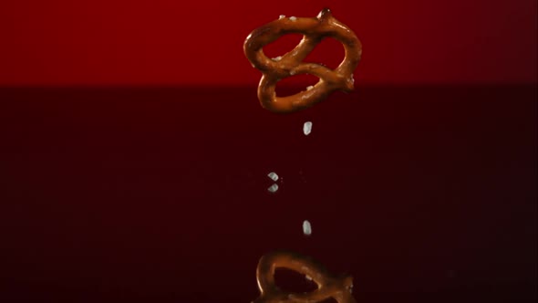 Pretzels falling and bouncing in ultra slow mo 1500fps - reflective surface - PRETZELS PHANTOM 