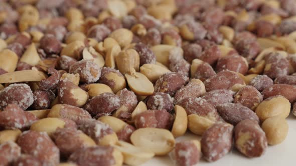 Arachis hypogaea popular snack 4K 2160p 30fps UltraHD tilting  footage - Pile of roasted groundnuts 