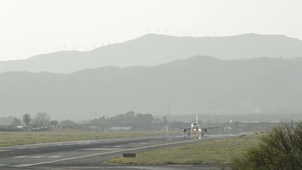 Airplane Taking Off at Sunset