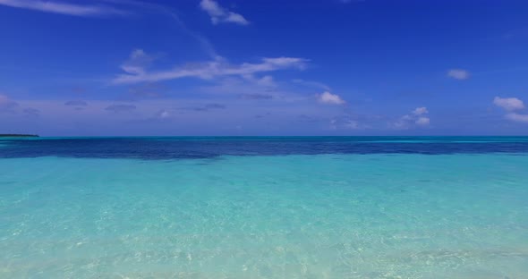 Tropical overhead copy space shot of a sandy white paradise beach and blue sea background in high re