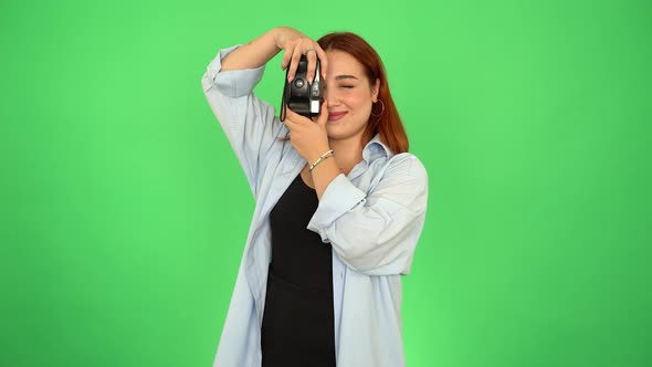 Photographer Woman Taking Photo on Green Screen 4K