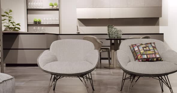 Modern Minimalist Home. Modern black lamp. Modern gray, white kitchen furniture.